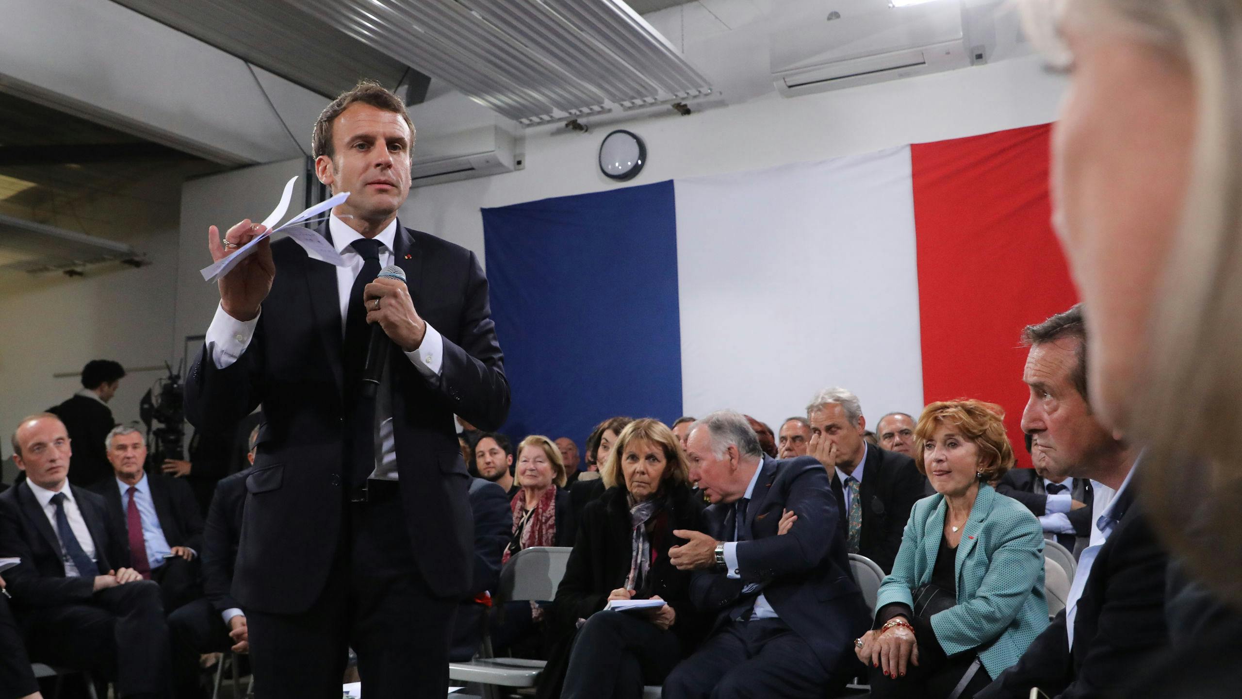 2019-04-04 20:28:04 French president Emmanuel Macron (L) speaks during the last public meeting set as part of his "Great National Debate" in Cozzano, on the French mediterranean island of Corsica, on April 4, 2019. French President Emmanuel Macron on April 4, 2019 wound up almost four months of town hall meetings aimed at reviving a presidency battered by weeks of street unrest with a prickly visit to France's Mediterranean island of Corsica. Ludovic MARIN / AFP
