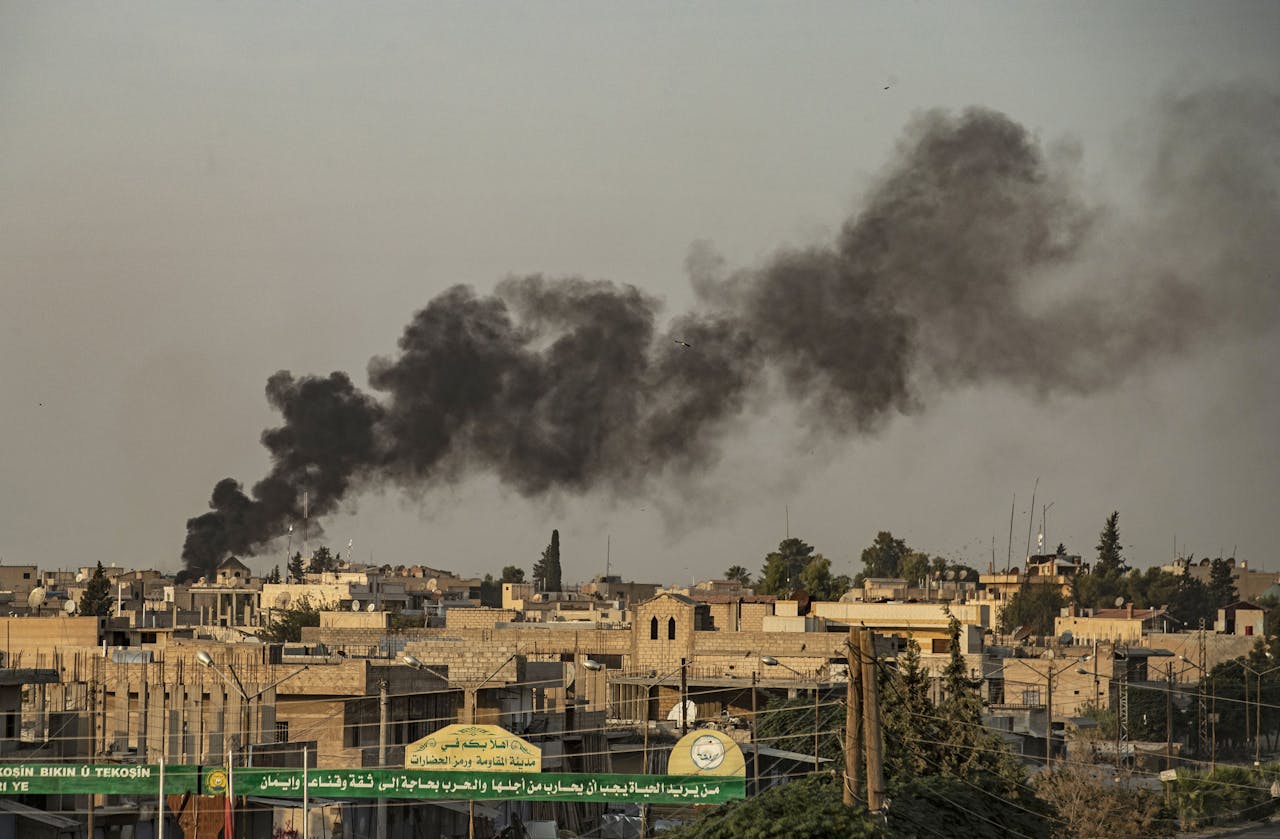 2019-10-09 18:48:01 Smoke billows following Turkish bombardment on Syria's northeastern town of Ras al-Ain.