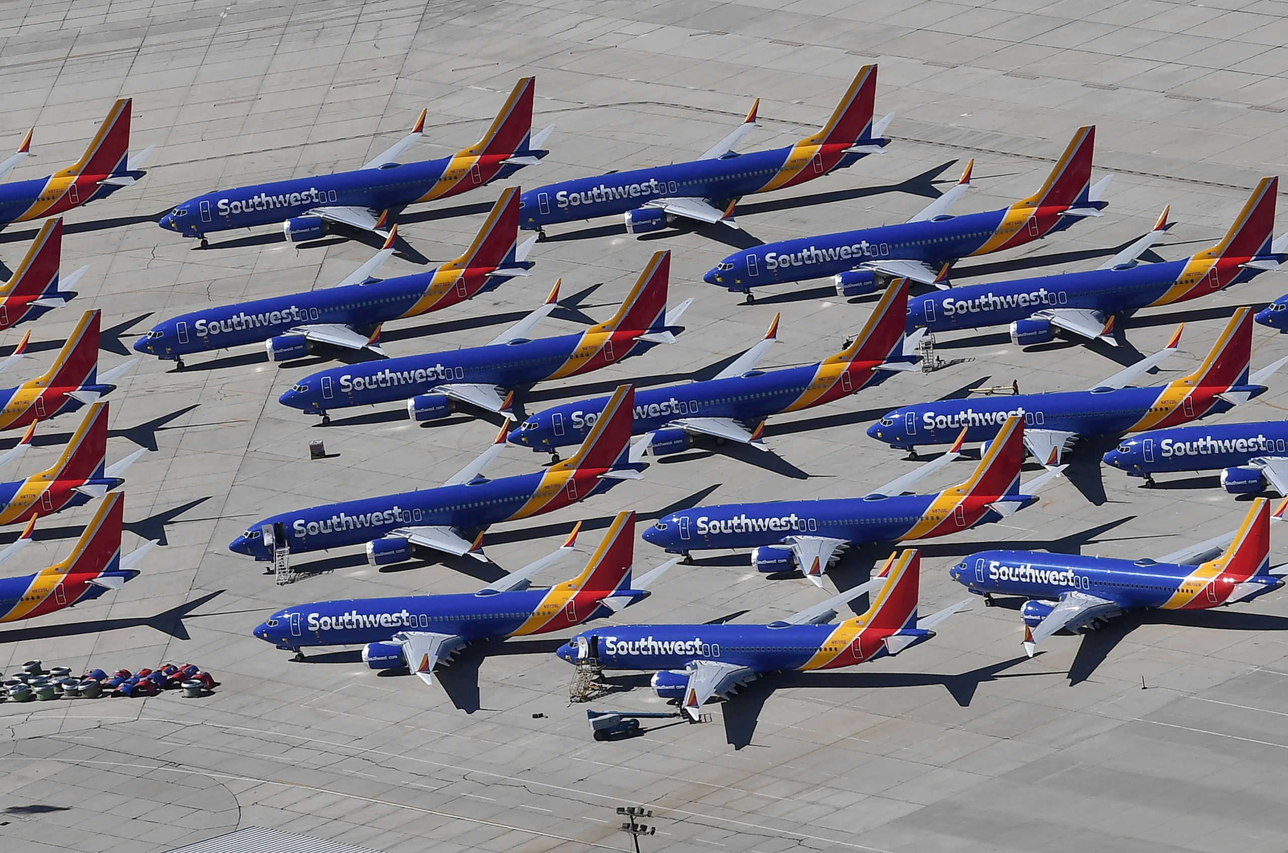 2019-03-28 15:12:57 Southwest Airlines Boeing 737 MAX aircraft are parked on the tarmac after being grounded, at the Southern California Logistics Airport in Victorville, California on March 28, 2019. After two fatal crashes in five months, Boeing is trying hard -- very hard -- to present itself as unfazed by the crisis that surrounds the company. The company's sprawling factory in Renton, Washington is a hive of activity on this sunny Wednesday, March 28, 2019, during a tightly-managed media tour as Boeing tries to communicate confidence that it has nothing to hide. Boeing gathered hundreds of pilots and reporters to unveil the changes to the MCAS stall prevention system, which has been implicated in the crashes in Ethiopia and Indonesia, as part of a charm offensive to restore the company's reputation. Mark RALSTON / AFP
