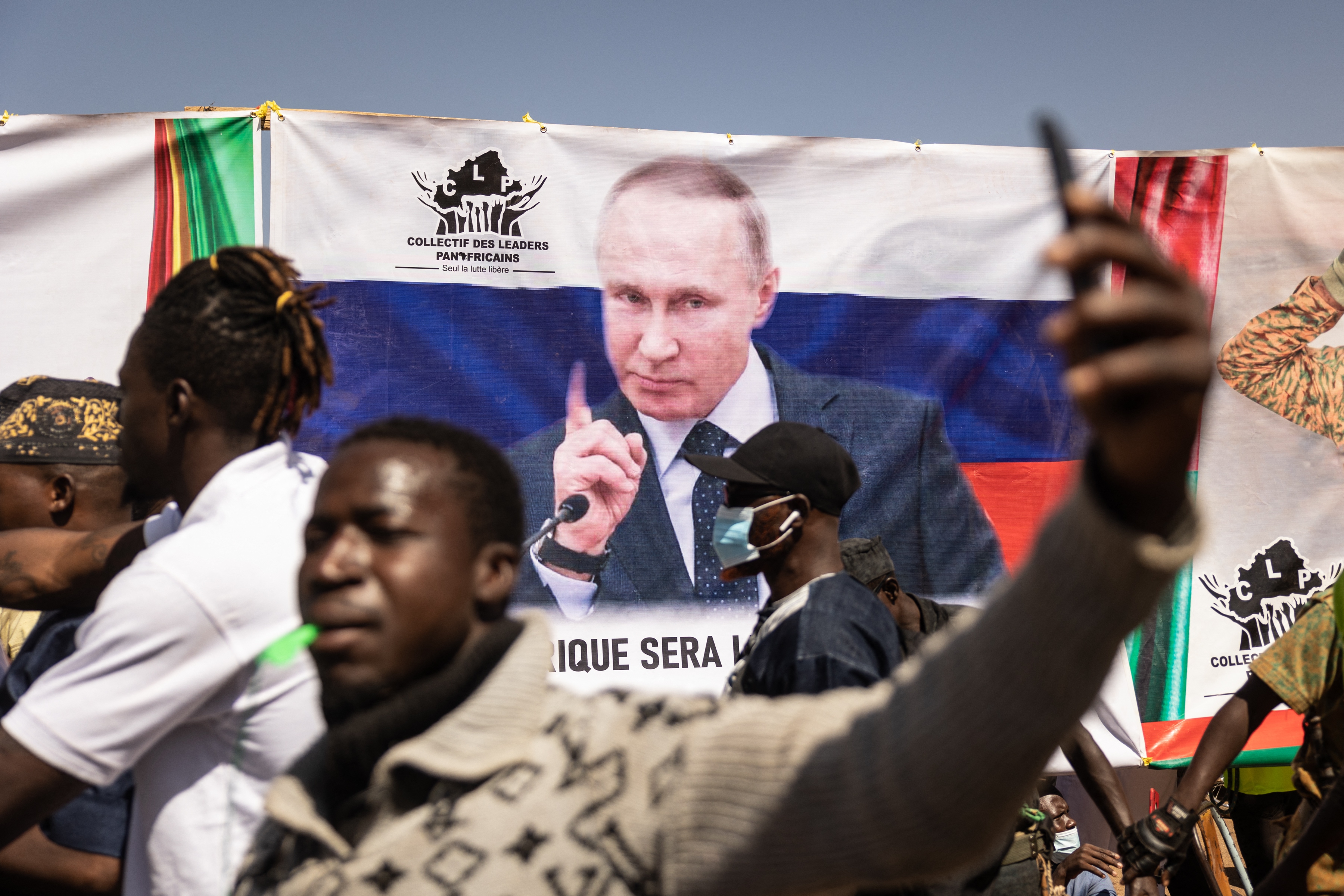 Vladimir Putin's flag is raised during a pro-Russian demonstration in Ouagadougou, Burkina Faso.