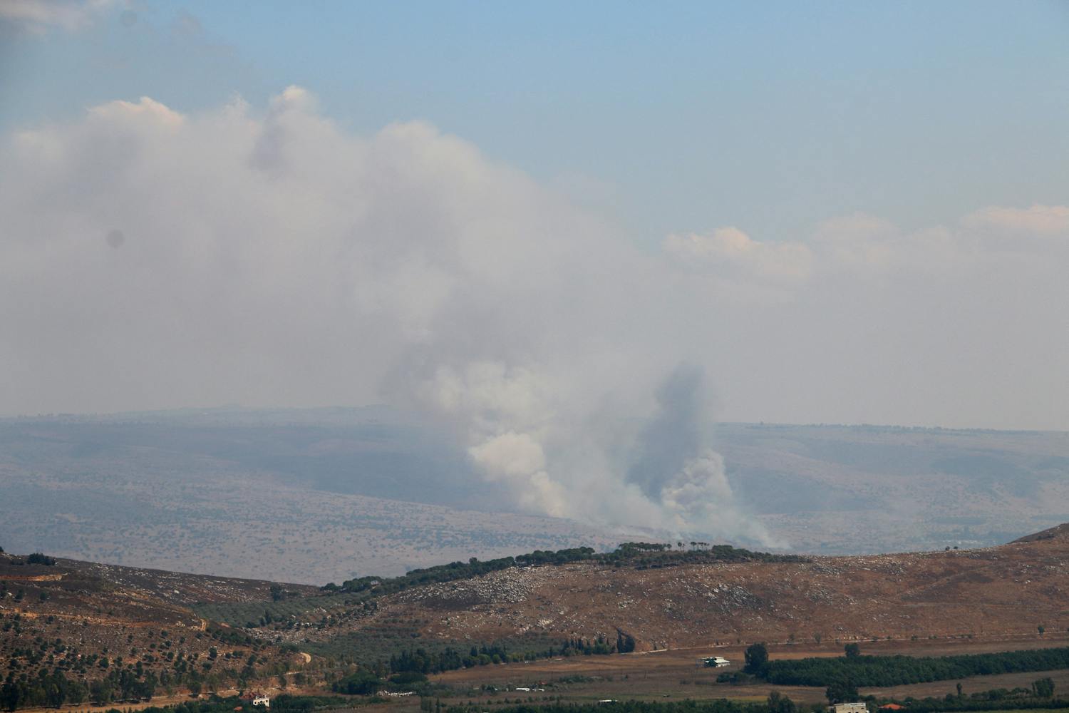 Hezbollah fires dozens of rockets at Israel