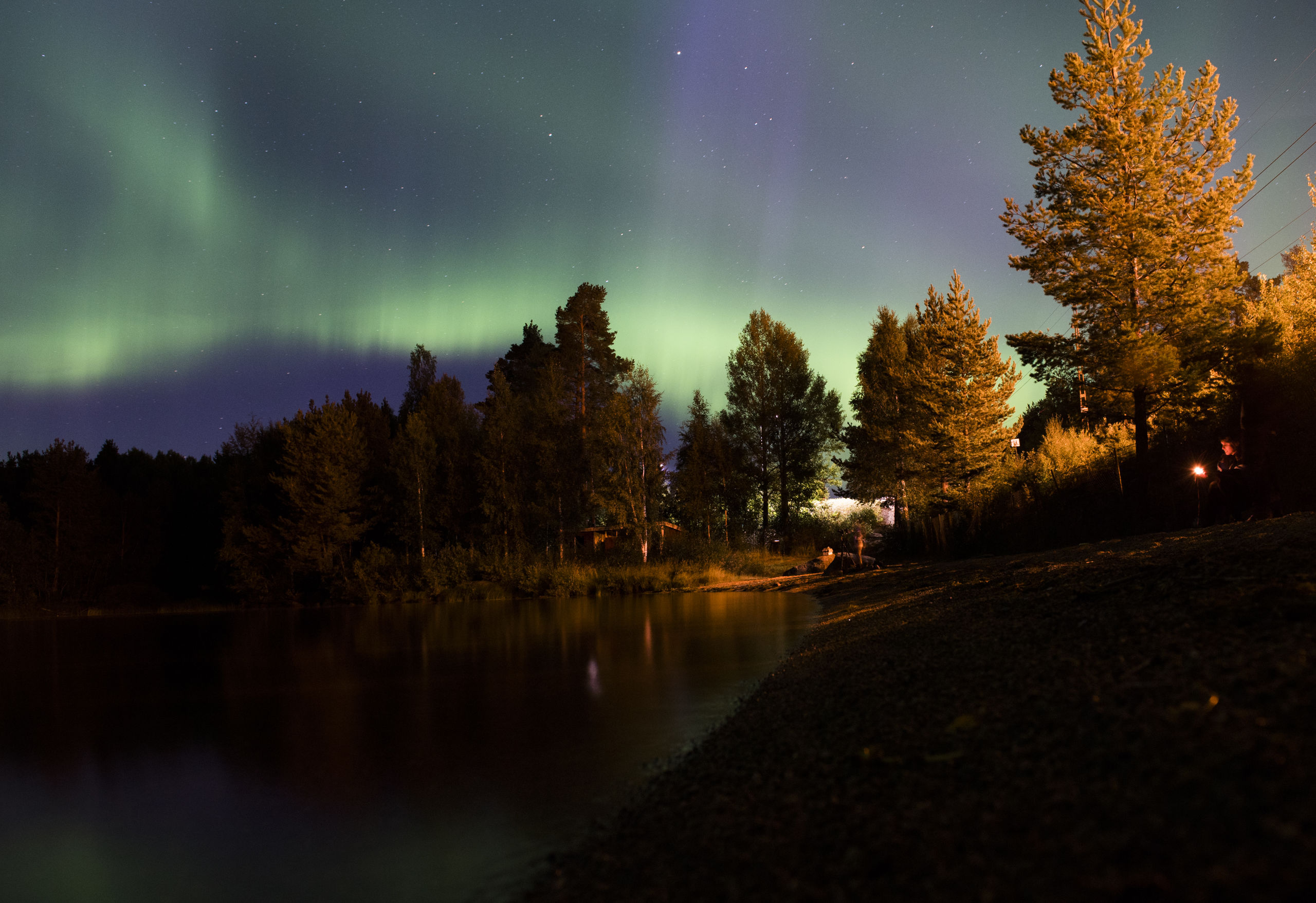Het Noorderlicht verschijnt aan de hemel van het Zweedse dorp Erikslund. JONATHAN NACKSTRAND 