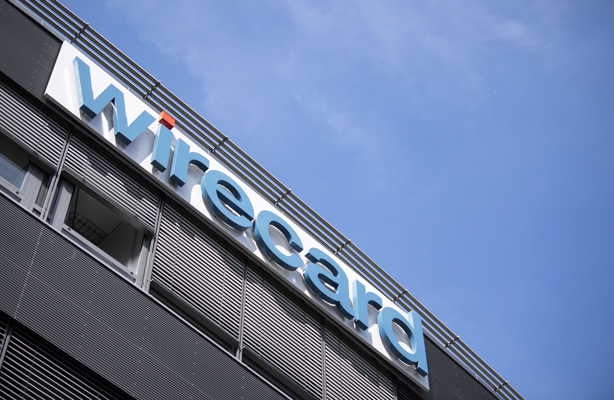 epa08493851 (FILE) The logo of the financial services company Wirecard at the company headquarters building in Aschheim near Munich, Bavaria, Germany, 25 April 2019. According to reports on 18 June 2020, Wirecard shares lost 65% as the German payment processor announced, its auditor can’t find evidence for a quarter of the cash on its balance sheet.  EPA/LUKAS BARTH-TUTTAS *** Local Caption *** 56083317