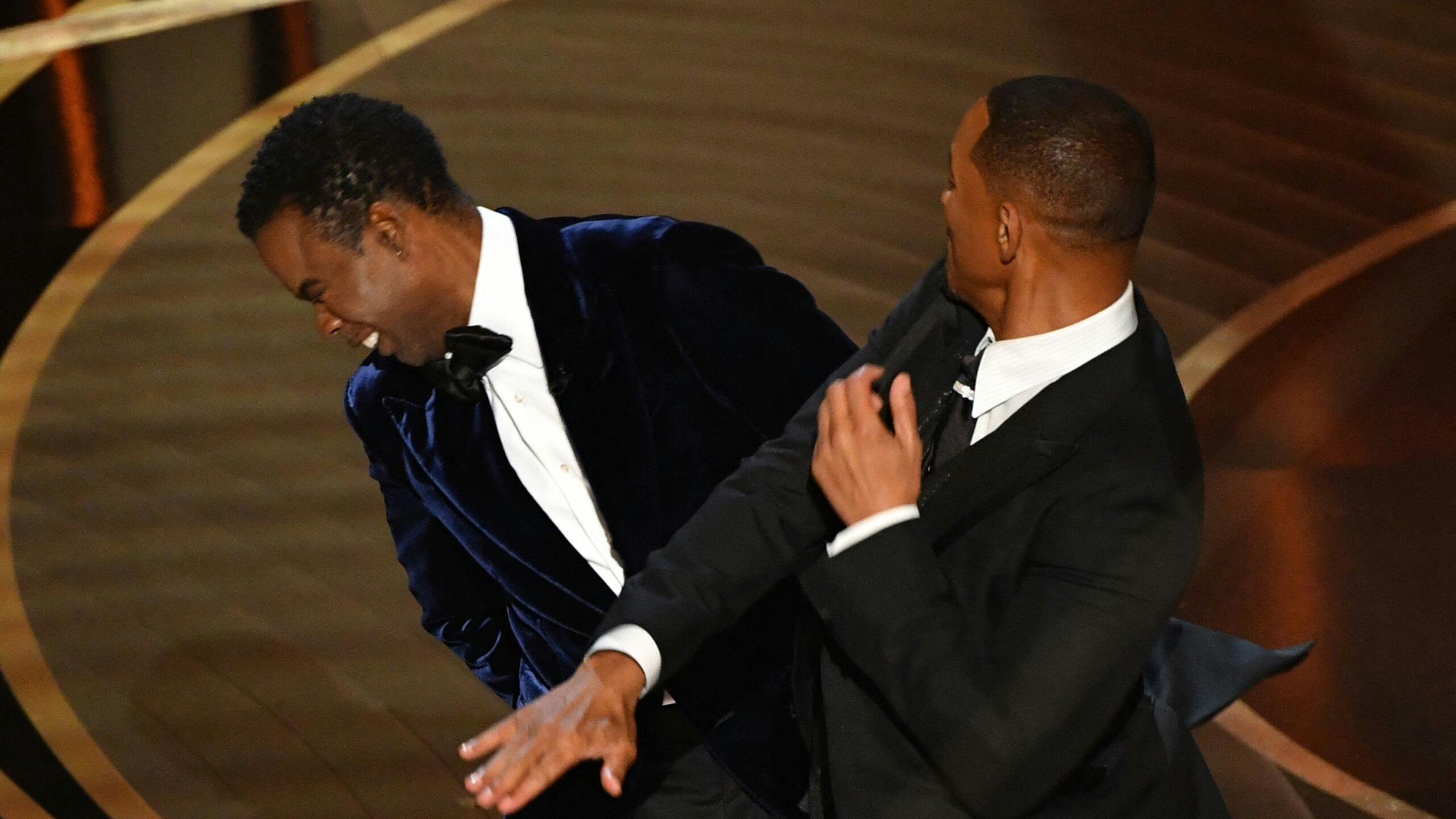 US actor Will Smith (R) slaps US actor Chris Rock onstage during the 94th Oscars at the Dolby Theatre in Hollywood, California on March 27, 2022.   Robyn Beck / AFP