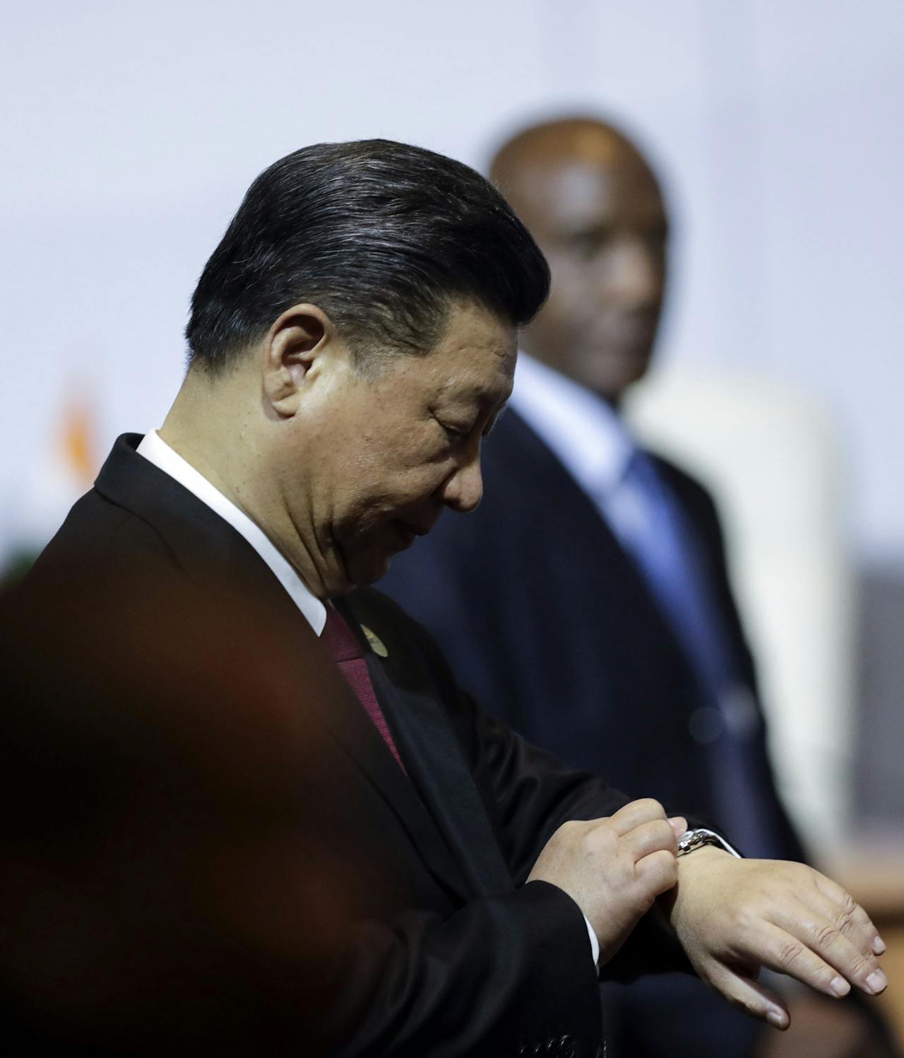 2018-07-26 14:45:15 Chinese President Xi Jinping looks at his watch after the open session meeting of the 10th BRICS summit (acronym for the grouping of the world's leading emerging economies, namely Brazil, Russia, India, China and South Africa) on July 26, 2018 at the Sandton Convention Centre in Johannesburg, South Africa. Themba Hadebe / POOL / AFP