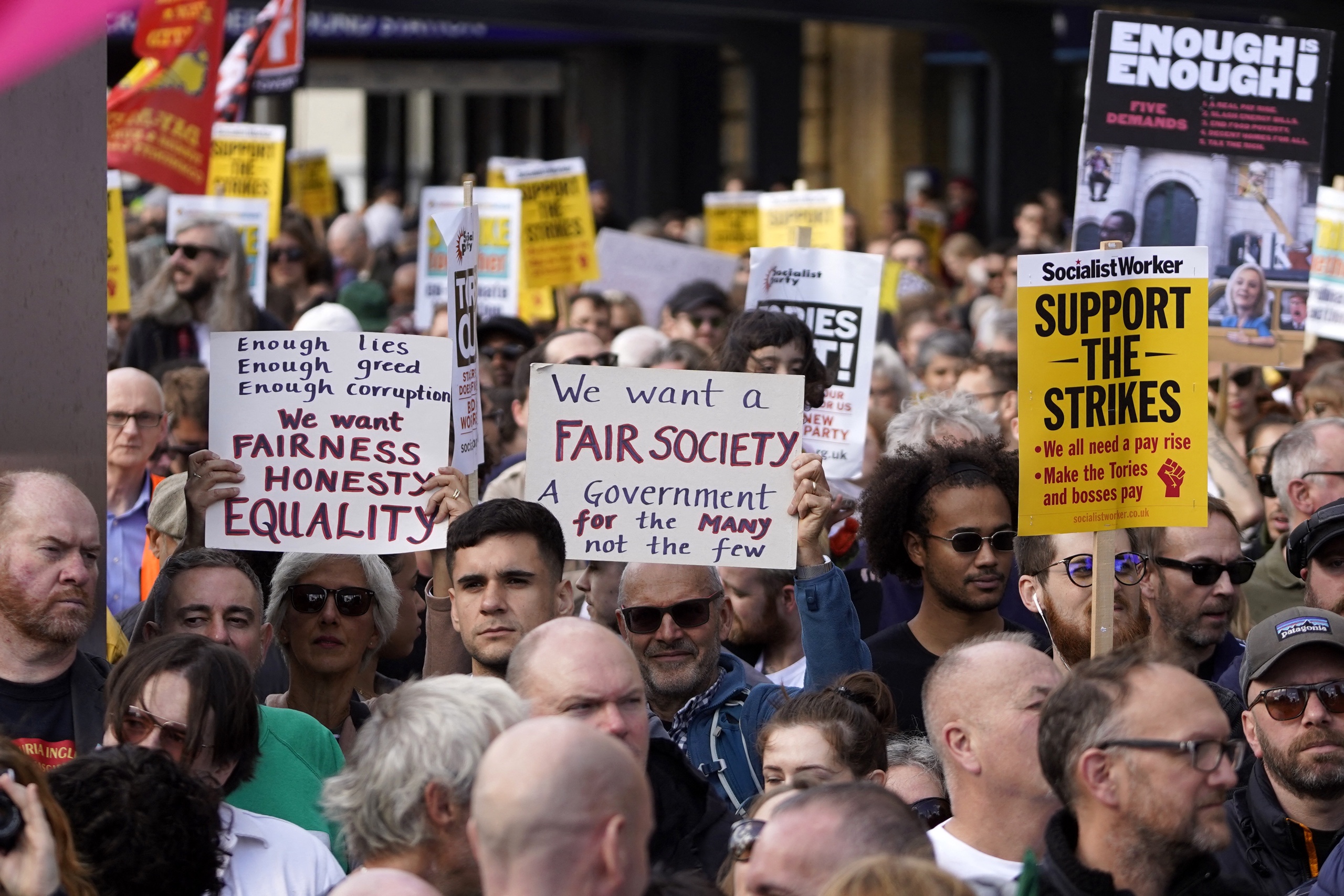 The demonstration in London was organized by Enough is Enough.  This action group was formed by unions and social organizations in protest against rising costs of living, low wages, wealth inequality, and housing shortages. 