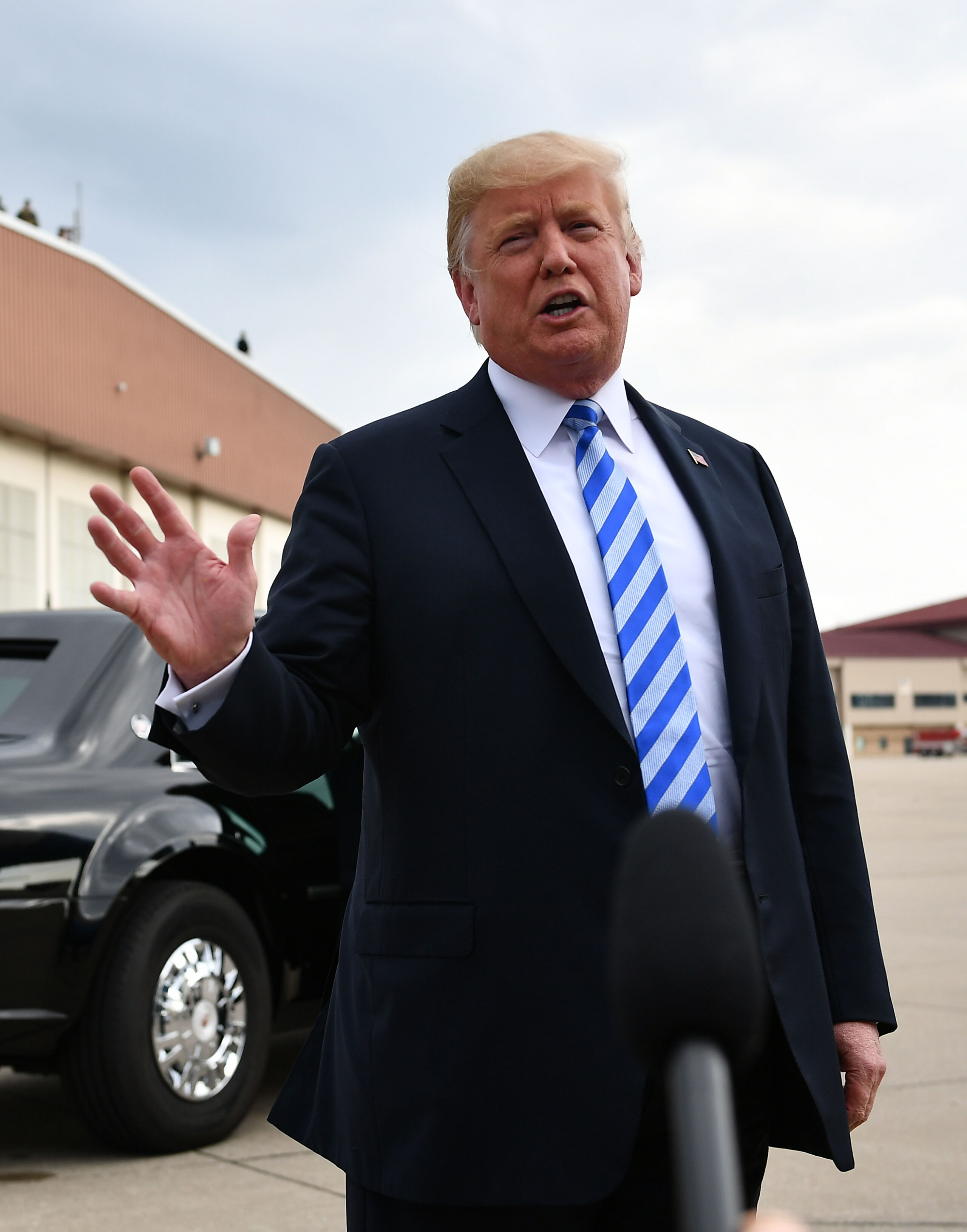 2018-08-21 23:39:08 US President Donald Trump speaks to the press upon arrival at Yeager Airport in Charleston, West Virginia on August 21, 2018.  Trump  said he was 'very sad' about Manafort conviction. Donald Trump's former campaign chief Paul Manafort was found guilty of fraud Tuesday, in the first trial resulting from the investigation into Russian meddling in the 2016 presidential election. MANDEL NGAN / AFP