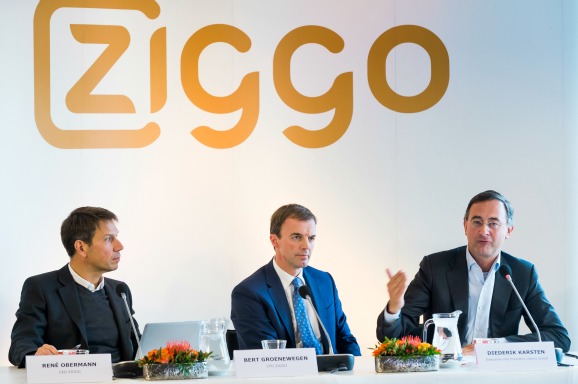 (VLNR) Rene Obermann, CEO van kabelexploitant Ziggo, Bert Groenewegen, financieel bestuurder van Ziggo en Diederik Karsten, executive Vice President of Liberty Global's European Broadband Operations tijdens een persconferencie. Foto: ANP