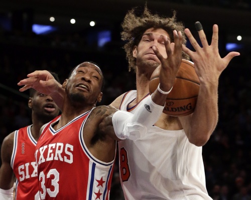 Robert Covington (L). EPA