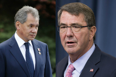 Links de Russische minister van Defensie Sergej Sjojgoe, en rechts zijn Amerikaanse collega Chuck Hagel. Foto: ANP