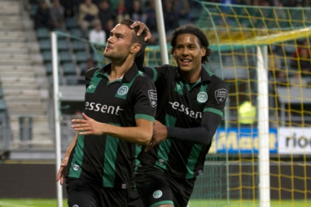 FC Groningen spelers Tim Sparv (L) en Virgel van Dijk (r) vieren de 0-1 tegen ADO. ANP