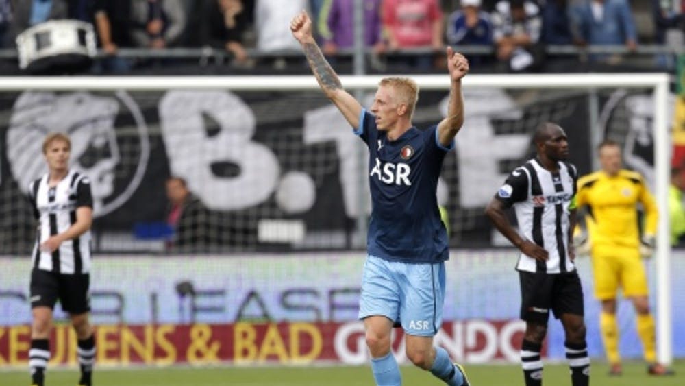 Feyenoord-speler Lex Immers juicht nadat hij de 0-2 heeft gescoord tegen Heracles. ANP