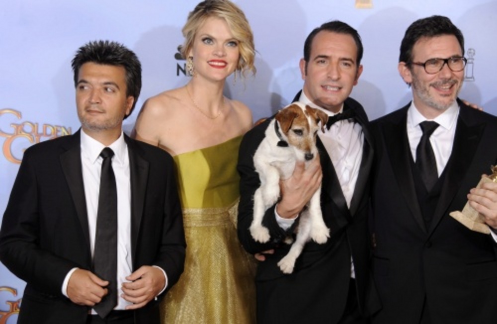 Producer Thomas Langmann, actrice Missi Pyle, acteur Jean Dujardin en regisseur Michel Hazanavicius van The Artist. EPA