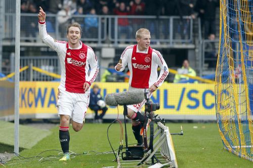 Christian Eriksen (L) en Davy Klaassen (R) van Ajax vieren de 0-1 van RKC-speler Guy Ramos. ANP