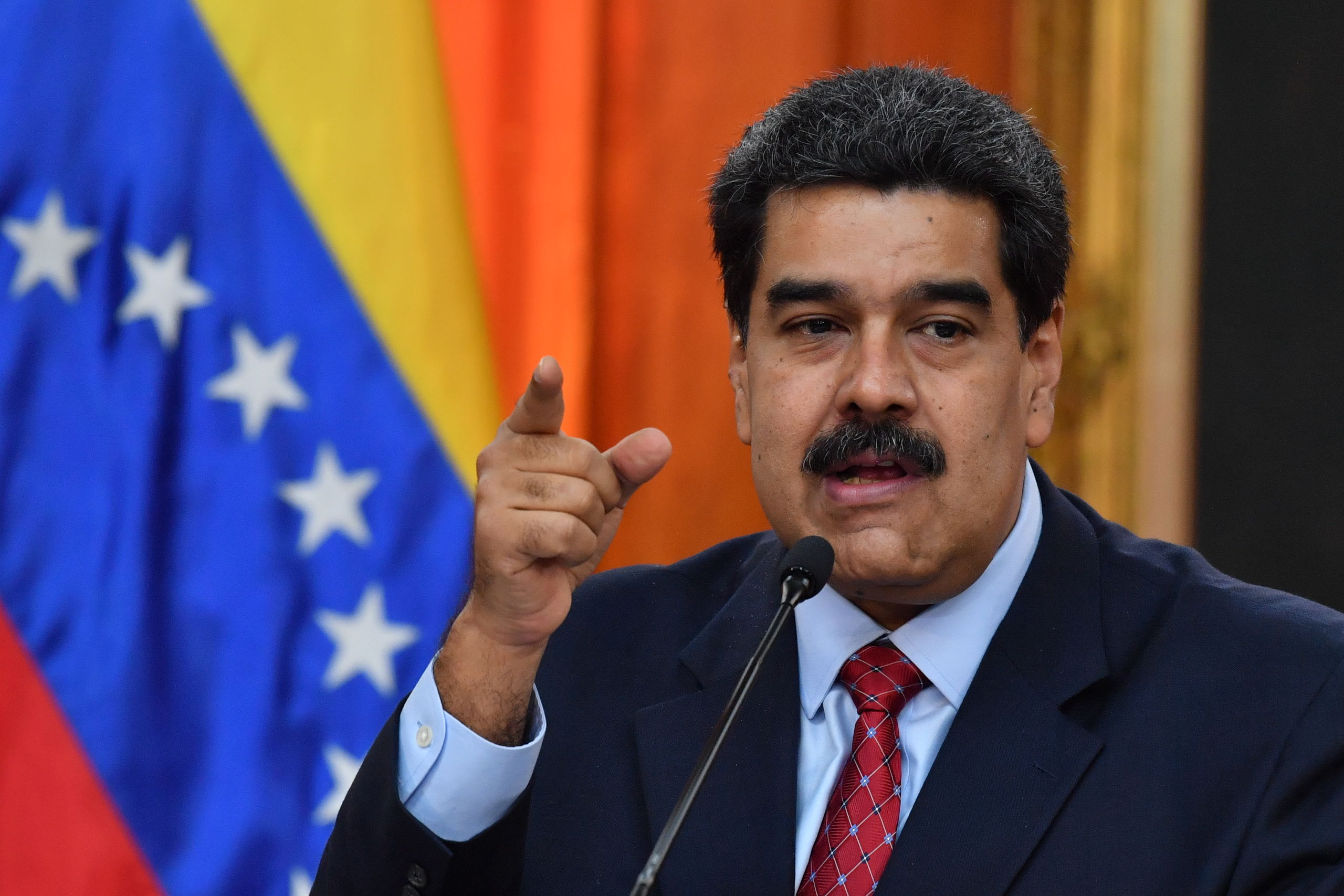 (FILES) In this file photo taken on January 25, 2019 Venezuelan President Nicolas Maduro offers a press conference in Caracas. - Venezuelan President Nicolas Maduro pledged on January 28 to retaliate against the United States for its new sanctions on state oil company PDVSA. (Photo by Yuri CORTEZ / AFP)