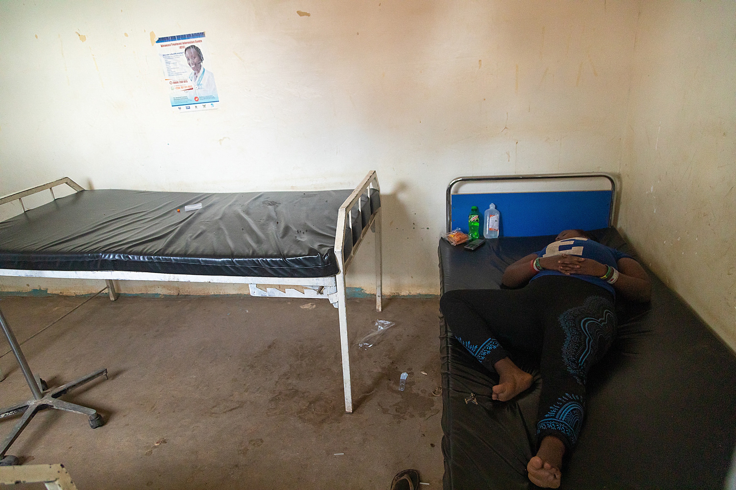 A suspected Ebola patient at Madudu Health center 3 awaits transfer to an isolation unit. 