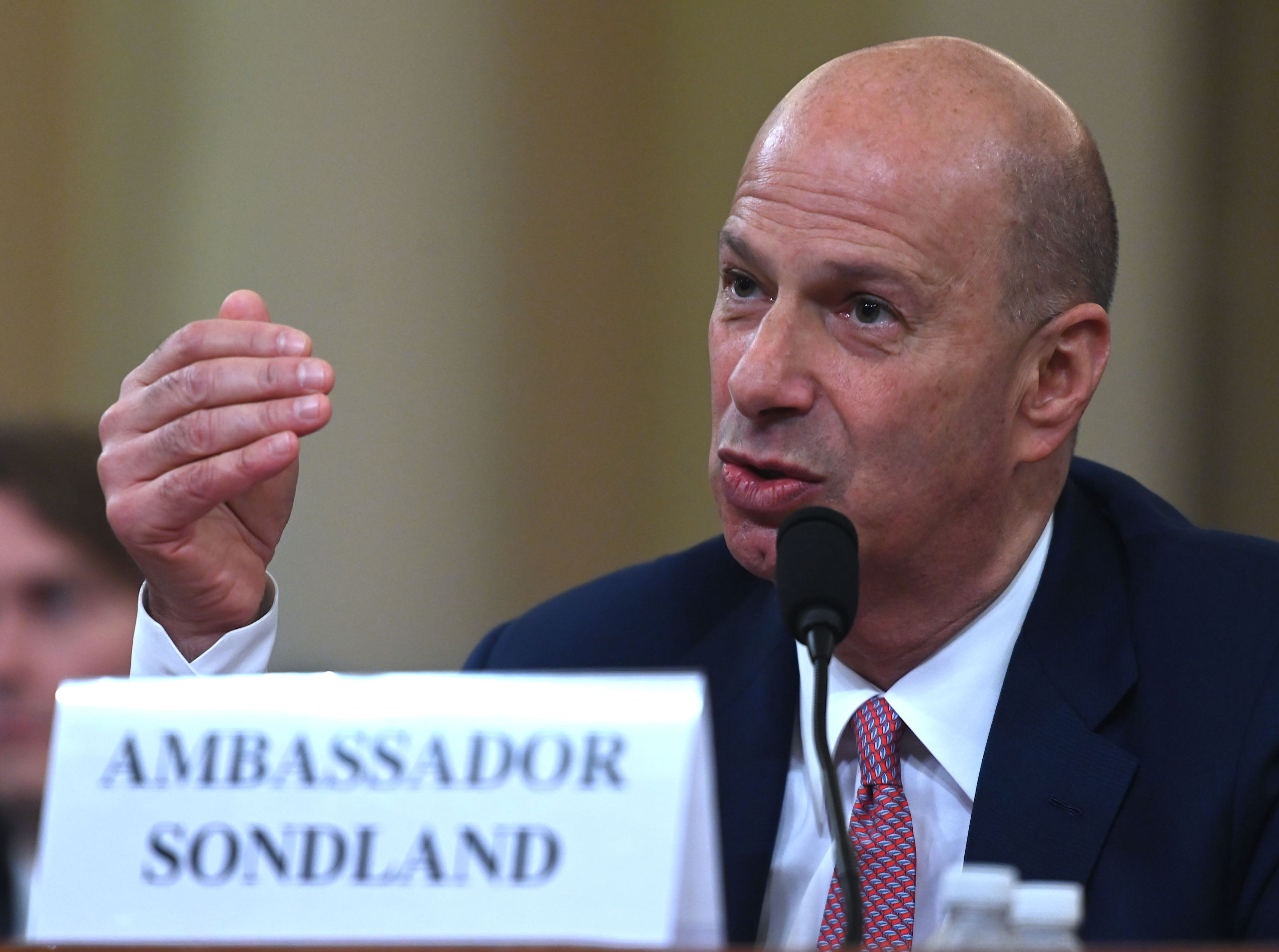 2019-11-20 18:25:31 US Ambassador to the European Union Gordon Sondland testifies during the House Intelligence Committee hearing as part of the impeachment inquiry into US President Donald Trump on Capitol Hill in Washington,DC on November 20, 2019.  The US ambassador to the European Union told an impeachment hearing Wednesday that he was following the orders of President Donald Trump in seeking a "quid pro quo" from Ukraine. Gordon Sondland -- whose appearance before Congress is being watched especially closely as he was a Trump ally -- said he believed the president was pressing Ukraine to investigate his potential 2020 rival Joe Biden. Andrew CABALLERO-REYNOLDS / AFP